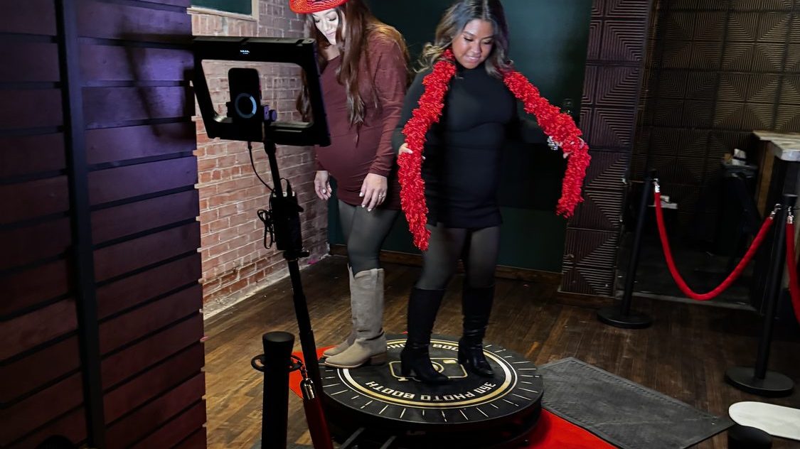 Guests on the Dynamic Celebrations 360 photo booth platform