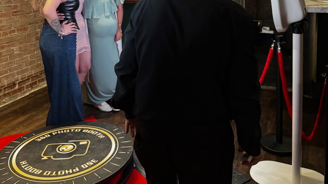 Guests on the Dynamic Celebrations 360 photo booth platform