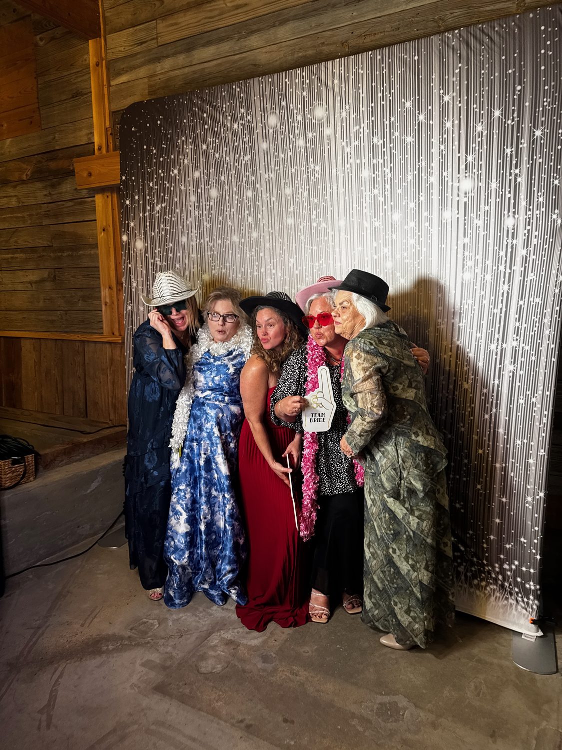 Guests at the Glam photo booth with studio lighting