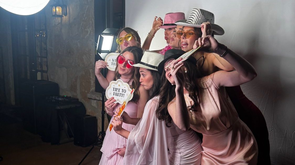 Guests at a Dynamic Celebrations photo booth