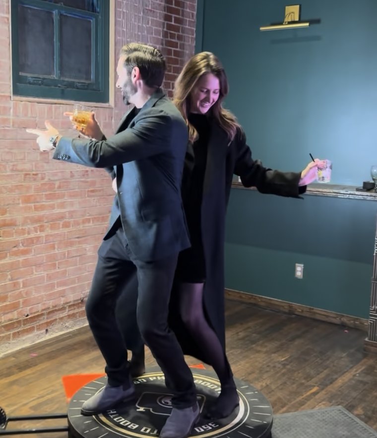 Guests dancing on the Dynamic Celebrations 360 photo booth platform
