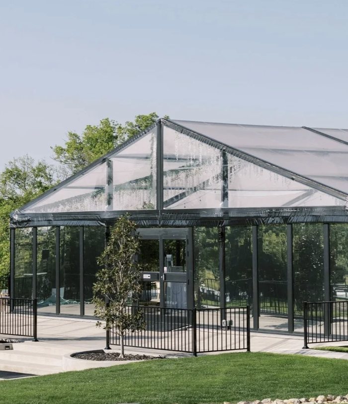 The glass reception pavilion at The Delanie in Forney, Texas