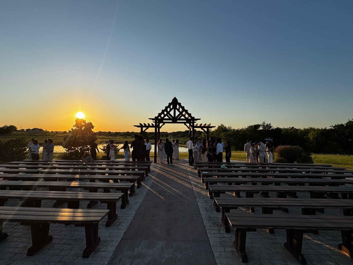 An outdoor ceremony site at sunset
