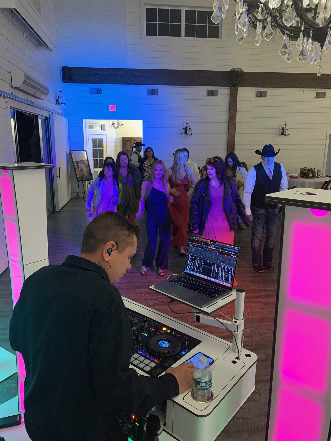 The Dynamic Celebrations DJ and MC working the booth