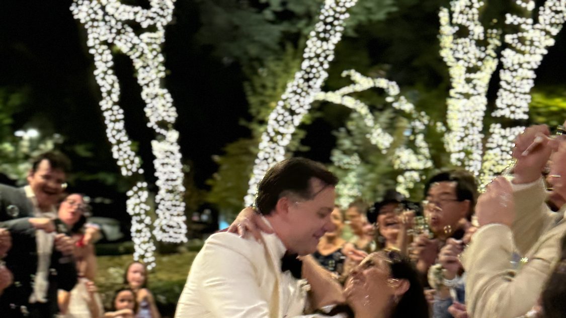 A first dance dip in front of the whole guest list