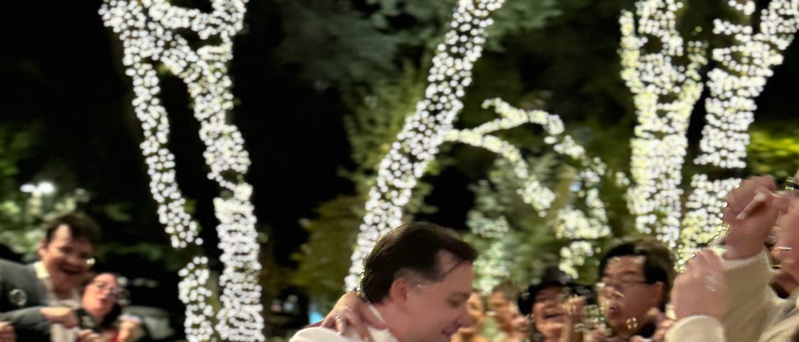 A first dance dip in front of the whole guest list