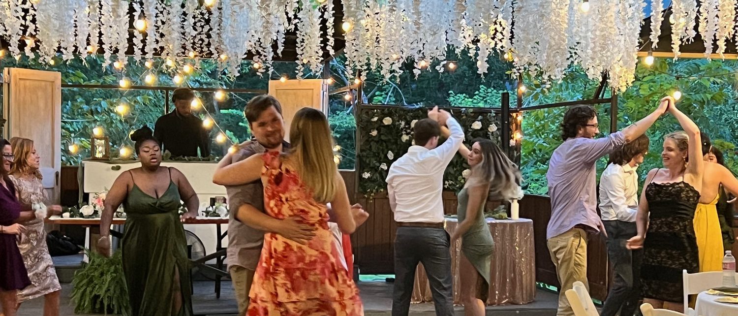 A reception in full swing under string lights