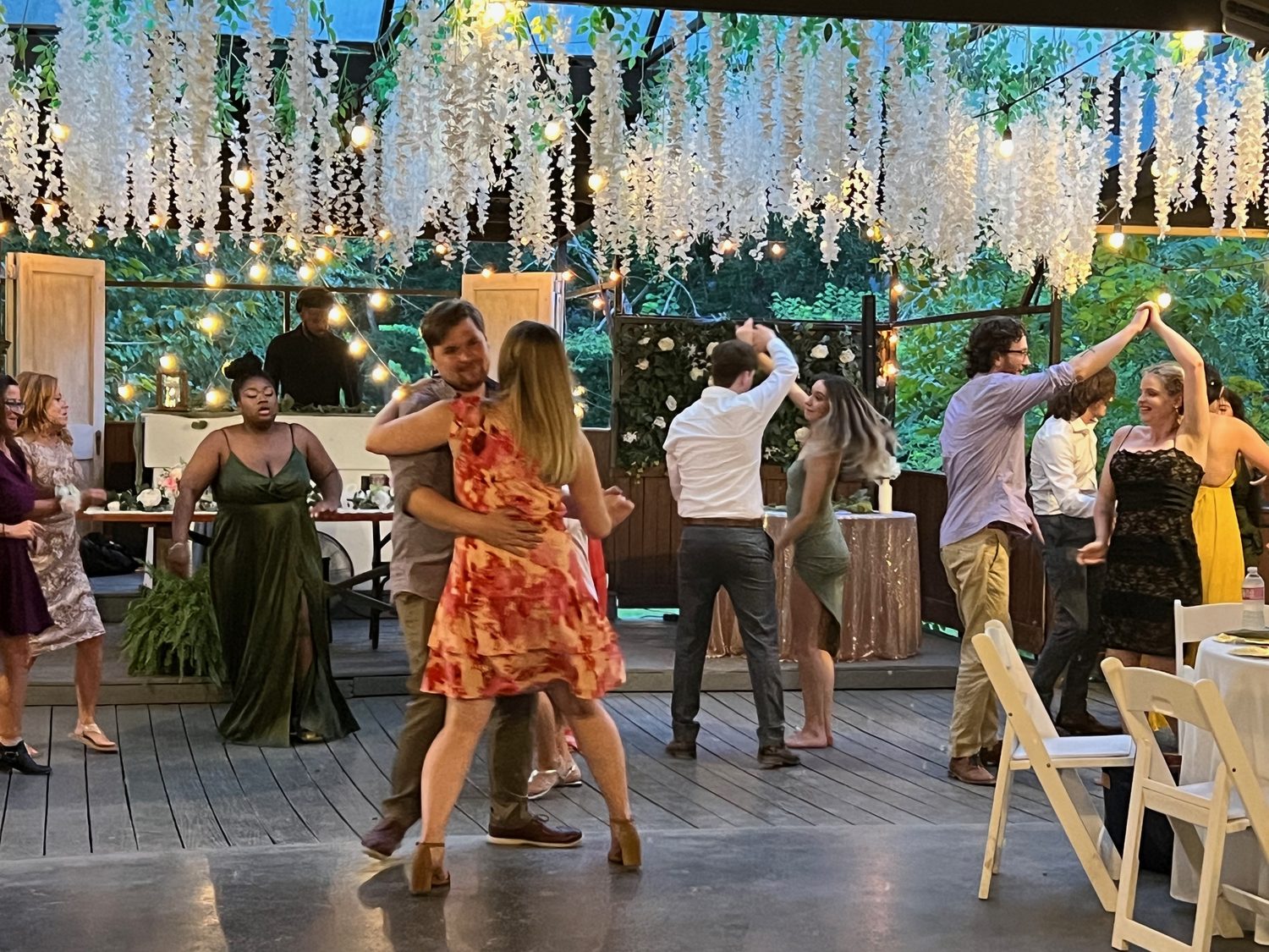 A reception in full swing under string lights